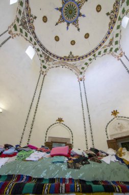 OBROCHISHTE, BULGARIA - JUNE 6, 2019: Ak Yazili Sultan Baba Dervish, tekke, an inside view the 16 century tomb of the muslim religious bektashi leader in Obrochishte, Bulgaria clipart