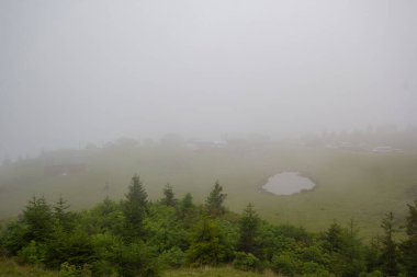 foggy view of lake in Kackar mountains, Badara plateau Rize, Blacksea, Turkey clipart