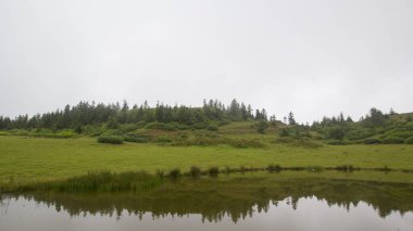 foggy view of lake in Kackar mountains, Badara plateau Rize, Blacksea, Turkey clipart