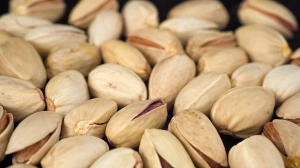 Tasty pistachios nuts. Camera above roasted salted pistachio nuts. High quality photo