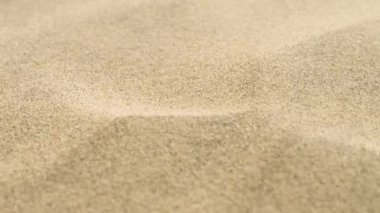 Altın kum dokusu arka planı. Macro kumsal taşı. Yüksek kaliteli video