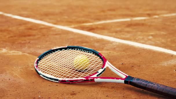 Tennis Racket Ball Lying Orange Court High Quality Video Footage — Stock Video