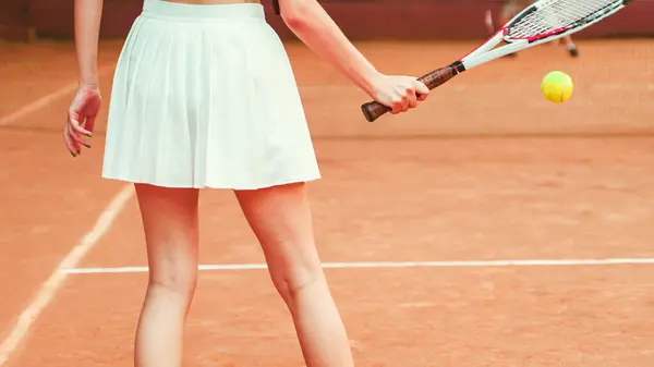 body part of a young woman during a tennis game. High quality photo