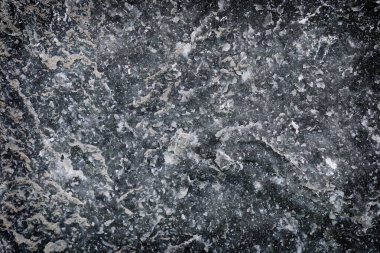 Arka plan için kenar gölgesi olan siyah ve beyaz taş dokusudur.