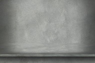 Çimento duvarı. Rafta desen var..