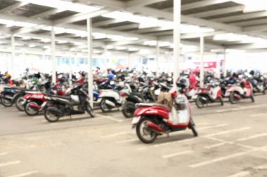 it is abstract blur motorcycle parking for background and design.