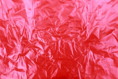 kırmızı buruşuk plastik doku arkaplanı.