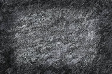 desen ve arkaplan için gölgesi olan siyah taş dokusu.