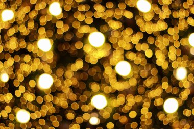 soyut bulanık altın noel ışıkları şablon ve arka plan için bohçalanır.