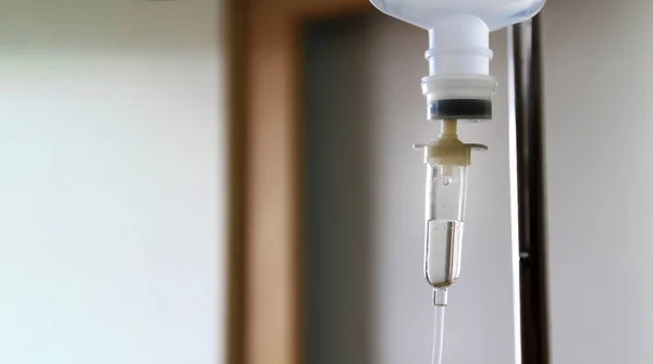 Close up intravenous fluid infusion during advanced surgery in operating room at hospital. Saline pump drip to blood loss patient people with copy space. Medical or medicine, repair healthy and cure