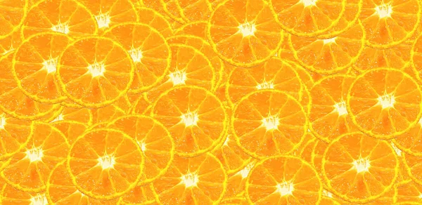 Half sliced of orange pattern background. Fresh fruit and colorful wallpaper concept.