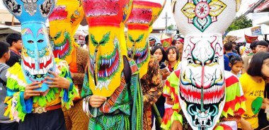Loei, Thailand- July 6, 2019: Phi Ta Khon or Ghost festival. Local people made and wearing colorful dress and ghost mask for celebrated culture or Religious traditions on July of every year    