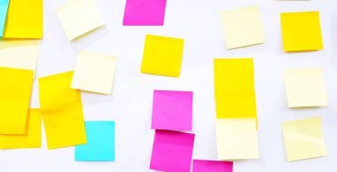 Colorful or multicolor post it isolated on white background. Group of paper sticky on wall to share idea, thinking, knowledge, opinion, message, information, notice and brainstorming for business.