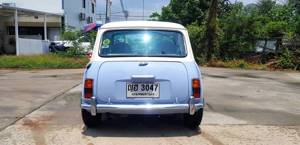 stock image Bangkok, Thailand - May 18, 2023: Beautiful Blue and White classic Mini cooper parked on the street or road. Old and smalll vehicle, Transportation and Vintage car concept 