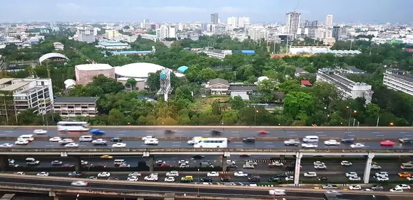 Aerial view of many cars rushing along expressway and street or road during rush hour in Bangkok. Transportation, Structure and Exterior design.