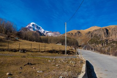 Georgia : 10-11-2022 : Country of Georgia, Kazbegi, Panoramic landscape of beautiful natural mountains, view of amazing Caucasus mountain peaks and meadows in Kazbegi national park.