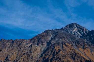 Georgia : 10-11-2022 : Country of Georgia, Kazbegi, Panoramic landscape of beautiful natural mountains, view of amazing Caucasus mountain peaks and meadows in Kazbegi national park.