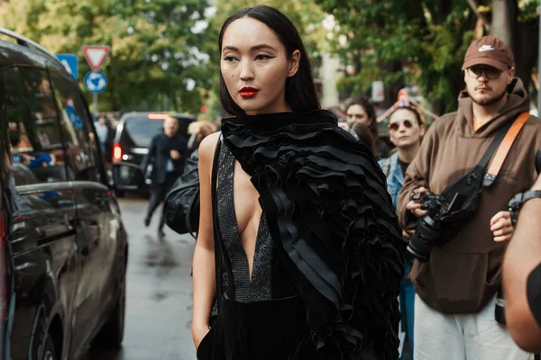 stock image A guest outside Emporio Armani show during Milan Fashion Week Womenswear Spring/Summer 2024.