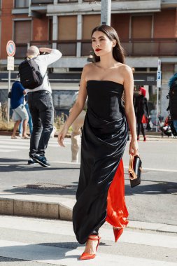 Fer Millan wears all Ferragamo, outside Salvatore Ferragamo show during Milan Fashion Week Womenswear Spring/Summer 2024. clipart