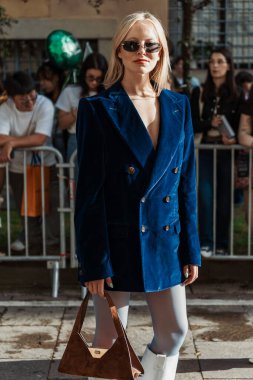 A guest outside Bally show during Milan Fashion Week Womenswear Spring/Summer 2024. clipart