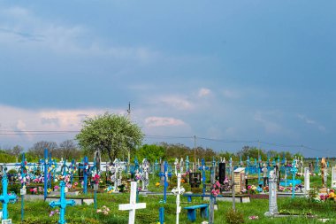 ONISHKI, UKRAINE - MAY 4, 2022: Cemetery in Onishki, Ukraine on May 4, 2022.