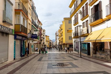RONDA, SPAIN - OCTOBER 23, 2022: Walking on white cozy streets in Ronda, Spain on October 23, 2022
