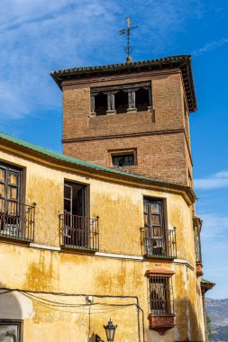 RONDA, SPAIN - OCTOBER 23, 2022: Walking on white cozy streets in Ronda, Spain on October 23, 2022