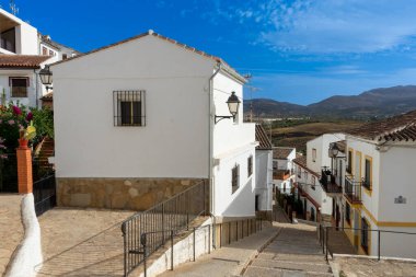 RONDA, SPAIN - OCTOBER 23, 2022: Walking on white cozy streets in Ronda, Spain on October 23, 2022