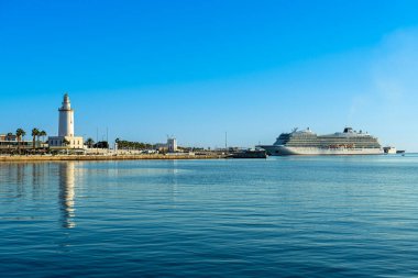 MALAGA, SPAIN - JANUARY 14, 2023: Panoramic view of Malaga port on sunset in Malaga, Spain on January 14, 2023