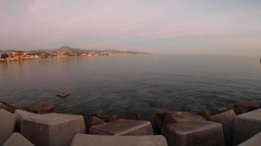 MALAGA, SPAIN - JANUARY 14, 2023: Panoramic view of sunset Malaga coastline, beach Malageta in Malaga, Spain on January 14, 2023