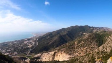 Landscape of Mediterranean sea and surrounding towns from the top of mount Calamorro, near Malaga in the Costa del Sol in Spain
