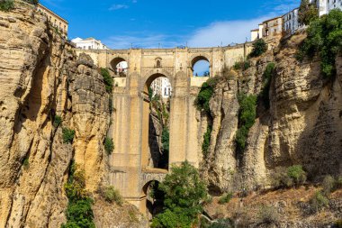 RONDA, SPAIN - OCTOBER 23, 2022: Panoramic view of Puente Nuevo Bridge at sunset in Ronda, Spain on October 23, 2022