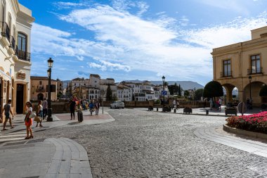 RONDA, SPAIN - OCTOBER 23, 2022: Walking on white cozy streets in Ronda, Spain on October 23, 2022