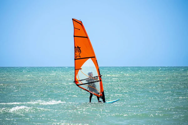 stock image TORREMOLINOS, SPAIN - MAY 28, 2023: Surfers on beach in Torremolinos, Spain on May 28, 2023