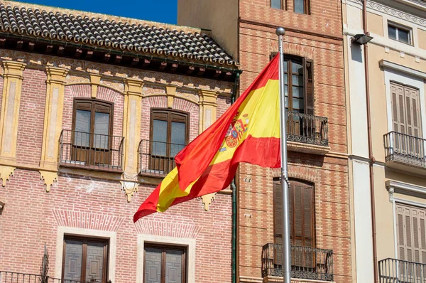 stock image MALAGA, SPAIN - June 6, 2023: Spanish flag on Constitution square in Malaga, Spain on June 6, 2023