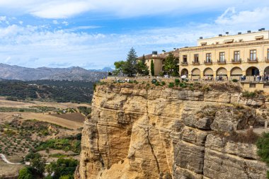 RONDA, SPAIN - OCTOBER 23, 2022: Panoramic view of canyon of Ronda near new Bridge in Ronda, Spain on October 23, 2022