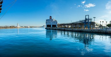 MALAGA, SPAIN - JANUARY 14, 2023: Panoramic view of Malaga port on sunset in Malaga, Spain on January 14, 2023