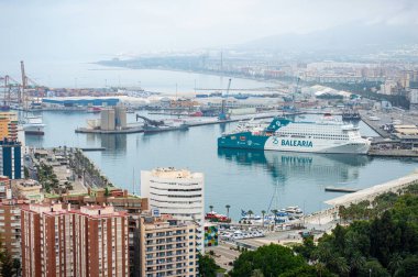 MALAGA, SPAIN - JULY 17, 2023: Panoramic aerial view of Malaga in a cloudy summer day in the morning in Malaga, Spain on July 17, 2023 clipart