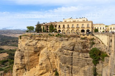 RONDA, SPAIN - OCTOBER 23, 2022: Panoramic view of Puente Nuevo Bridge at sunset in Ronda, Spain on October 23, 2022
