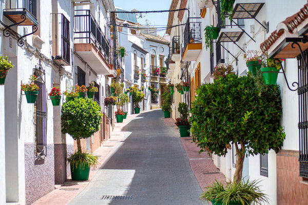 ESTEPONA, SPAIN - JULY 29, 2023: Walking in city center on sunny summer day in Estepona, Spain on July 29, 2023