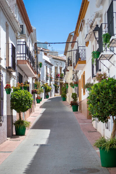 ESTEPONA, SPAIN - JULY 29, 2023: Walking in city center on sunny summer day in Estepona, Spain on July 29, 2023