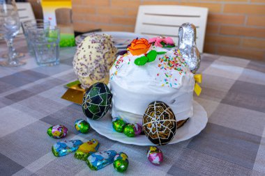 Traditional Ukrainian Easter cake (paska) with eggs (pysanky) clipart