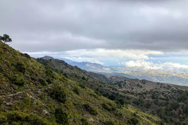 stock image Panoramic view from hiking trail to Maroma peak in thunderstorm day, Sierra Tejeda, Spain 