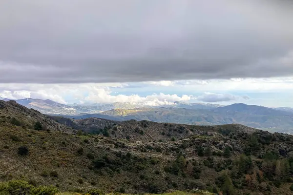 stock image Panoramic view from hiking trail to Maroma peak in thunderstorm day, Sierra Tejeda, Spain 