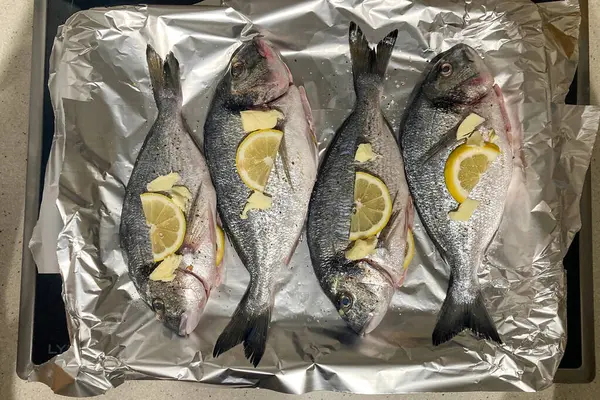 Cooking of dorado fish with lemon, handmade food series