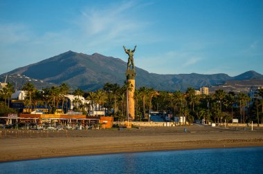 BANUS, SPAIN - MARCH 16, 2024: Statue La Victoria on sunrise in Banus, Spain on March 16, 2024 clipart