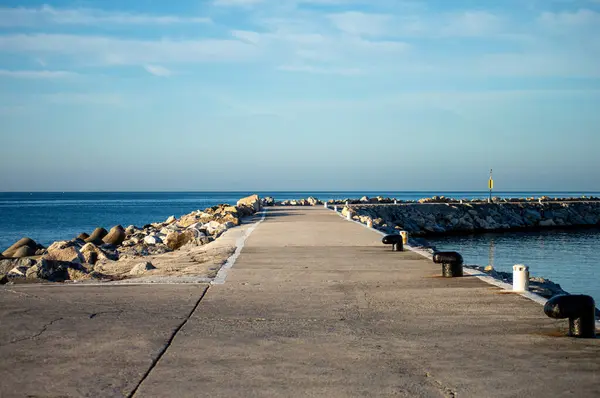 stock image BANUS, SPAIN - MARCH 16, 2024: Walking on sea promenade in  Banus, Spain on March 16, 2024