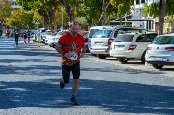 stock image TORREMOLINOS, SPAIN - FEBRUARY 4, 2024: Runners on half Marathon de Torremolinos in Torremolinos, Spain on February 4, 2024