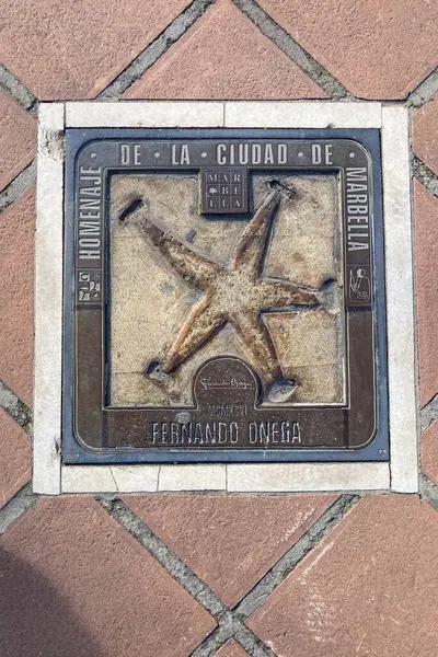 stock image BANUS, SPAIN - MARCH 16, 2024: Famous people tiles on the alley in Banus, Spain on March 16, 2024