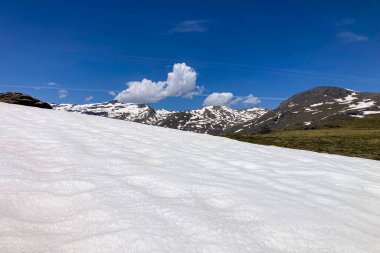 Panoramic view on snowy mountains on hiking trail to Mulhacen peak in the spring, Sierra Nevada range, Andalusia, Spain clipart